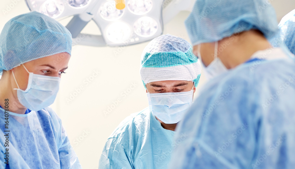 group of surgeons in operating room at hospital group of surgeons in operating room at hospital