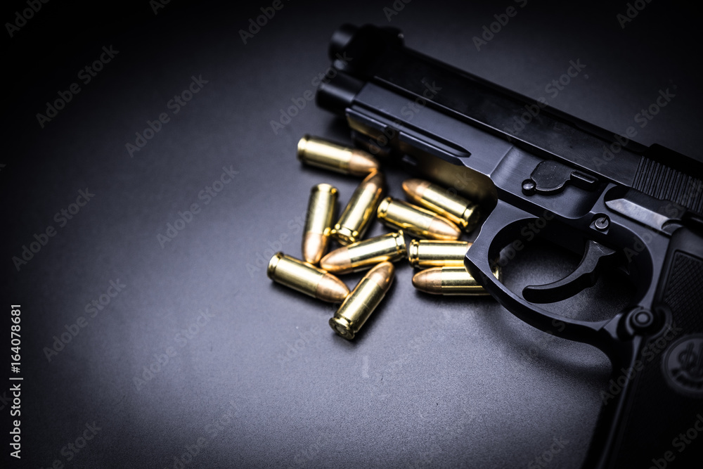  9mm pistol gun on black background