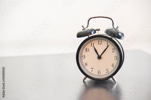 Vintage Morning Alarm Clock Isolated on Table