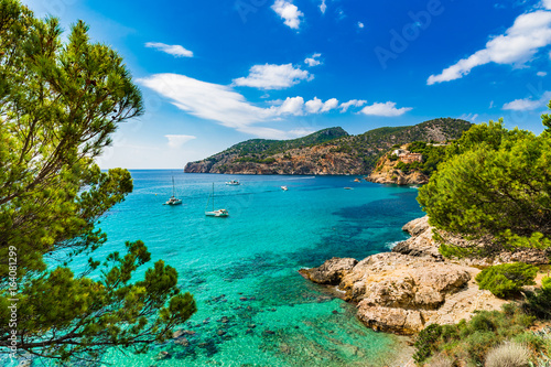 Idyllic sea view scenery of bay with boats on Majorca Island