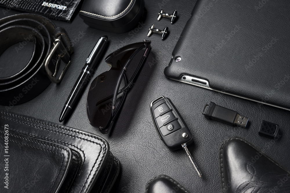 Man accessories in business style, gadgets, clothes, shoes, jewelry, and  other luxury businessman objects on leather black background, fashion  industry, selective focus Stock-Foto | Adobe Stock