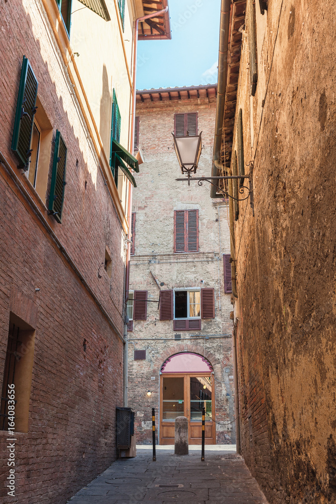 A narrow street in Siena, Italy