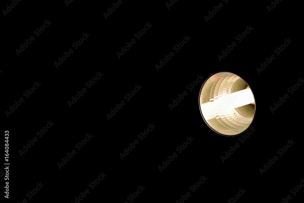 Triple Tube Bulb with Warm White Color Isolated on Black Background
