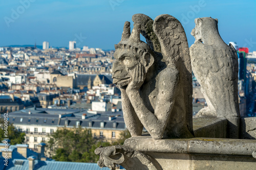 Close Up View of Paris Notre Dame Cathedral Gargoyle Against Cityscape