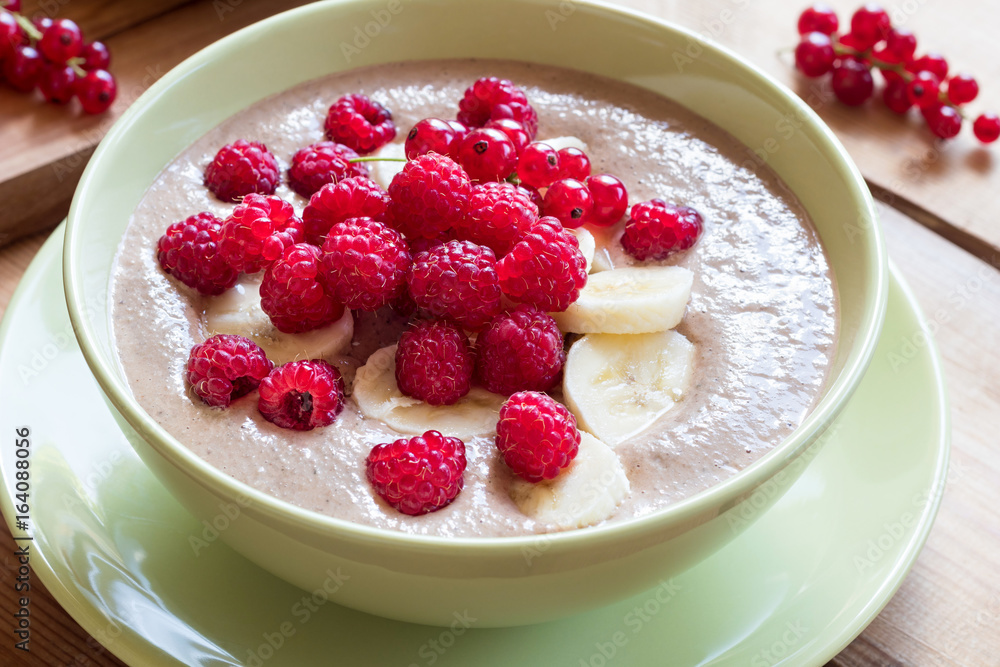 Summer breakfast - breakfast bowl with raspberries and currants Summer breakfast - breakfast bowl with raspberries and currants