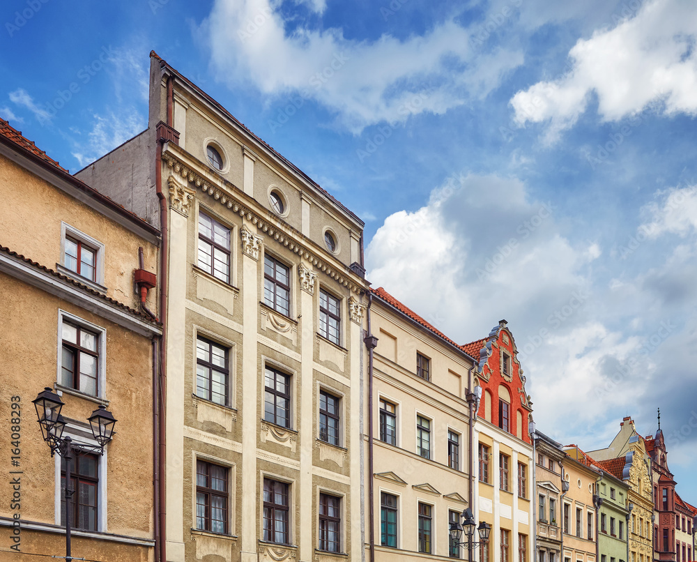 Facades of old tenement houses in Torun old town, Poland.