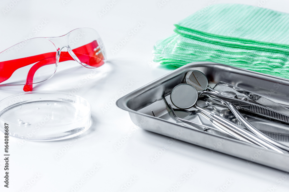 dentists tools in cabinet on white desktop dentists tools in cabinet on white desktop