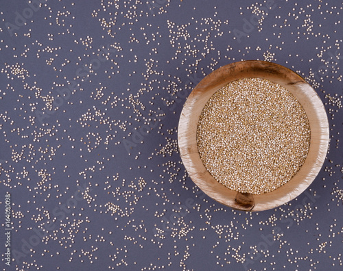 Quinoa in bowl on the dark background.