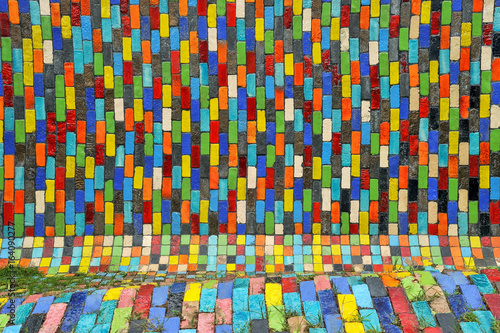 Walls are decorated with colorful paint on bricks.
