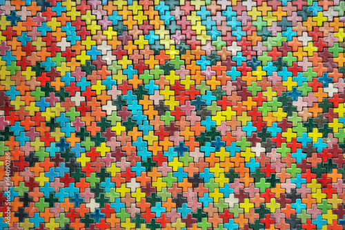 Walls are decorated with colorful ceramic shapes.