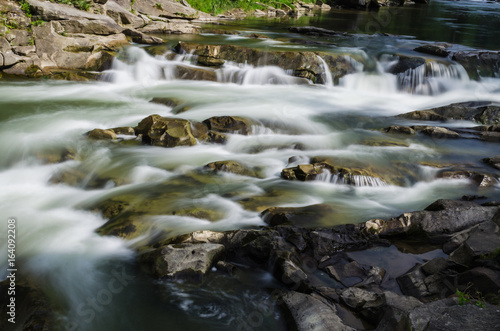 background landscape with waterfall in Yaremche vilage in Ukraine