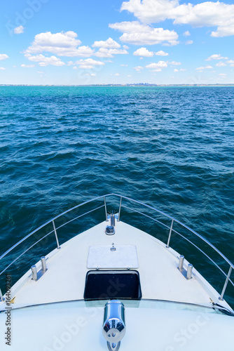 The nose of the boat on the water