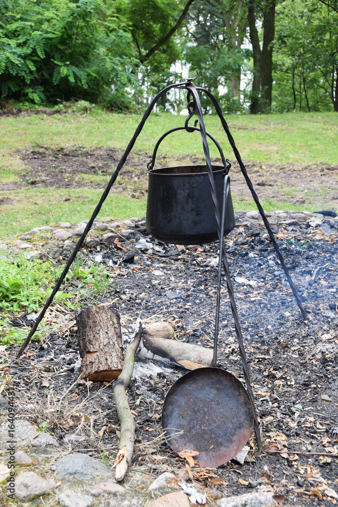 Metal medieval pot for cooking on fire Metal medieval pot for cooking on fire