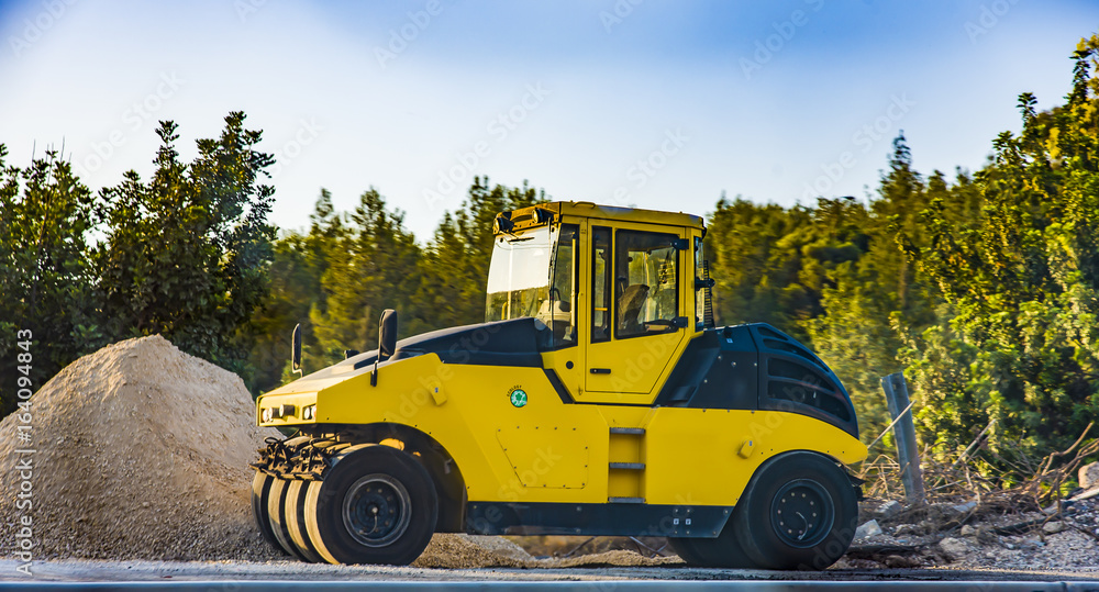 Heavy Vibration roller at asphalt pavement works Asphalt paver road repair