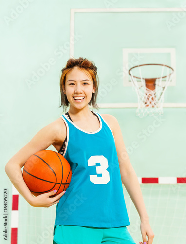 Portrait of happy teenage girl, basketball player © Sergey Novikov