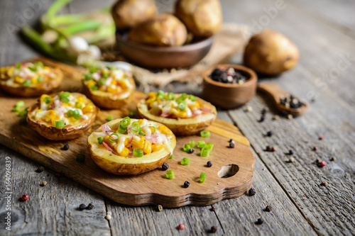 Potato boats filled with corn, ham, cheese and green onion