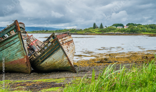 Abandoned and ruined ships along Isle of Mull coastline.
