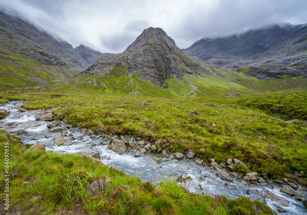 The famous Fairy Pools with the Black Cuillin Mountains in the background, Isle of Skye, Scotland.