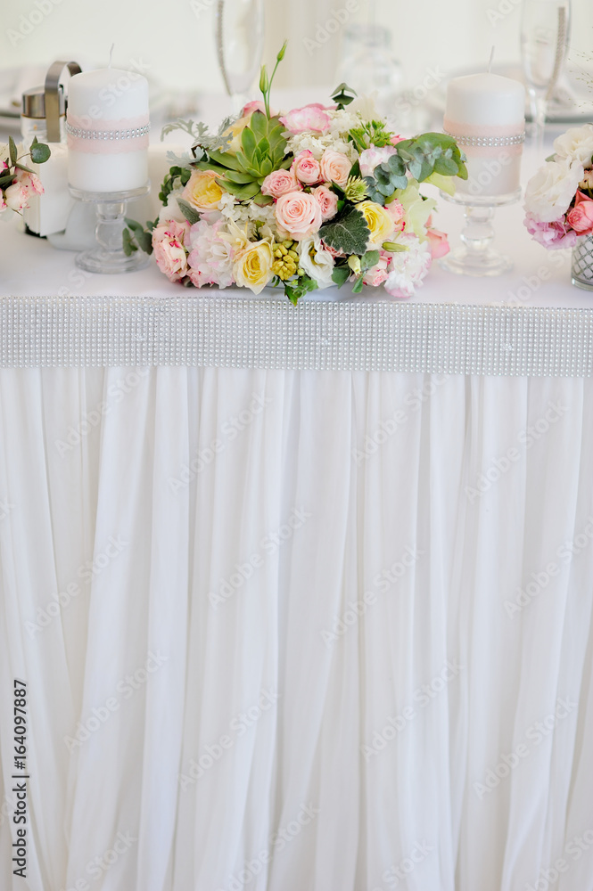 luxury wedding decorations with gentle rose and white tones, flower composition on a table of newlyweds luxury wedding decorations with gentle rose and white tones, flower composition on a table of newlyweds
