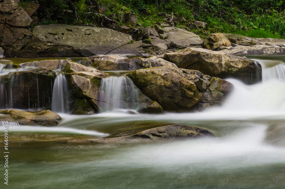 Fototapeta premium background landscape with waterfall in Yaremche vilage in Ukraine