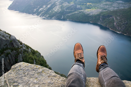 Sitting at the cliff of a fjord // Preikestolen, Norway