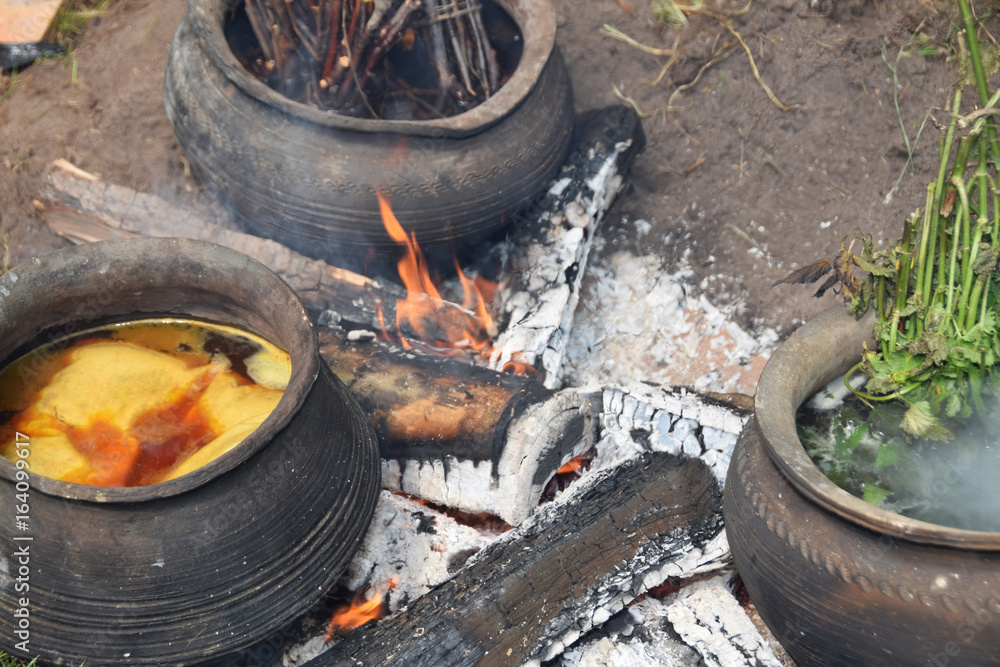 Clay pots for cooking natural wool on the bonfire Clay pots for cooking natural wool on the bonfire