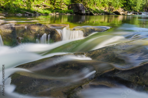 background landscape with waterfall in Yaremche vilage in Ukraine