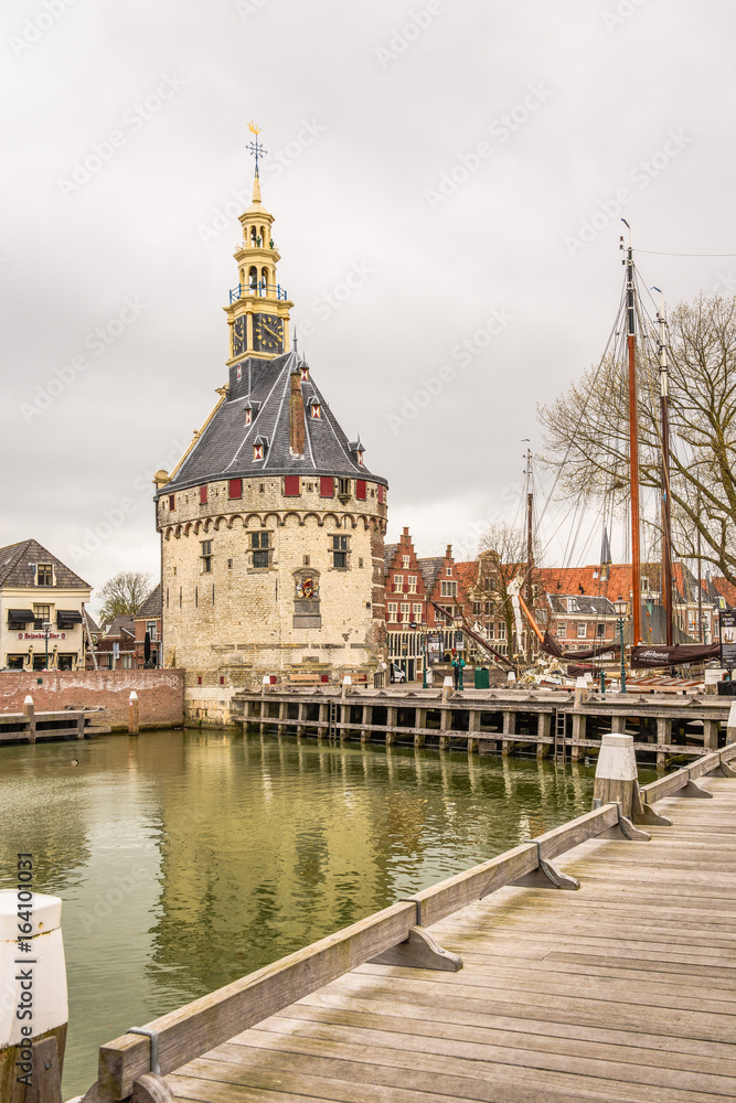 Obraz premium Clock tower building in the harbor of the town of Hoorn, Netherlands
