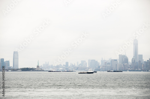 Manhattan skyline and statue of liberty seen from the ocean, New York © Oliver