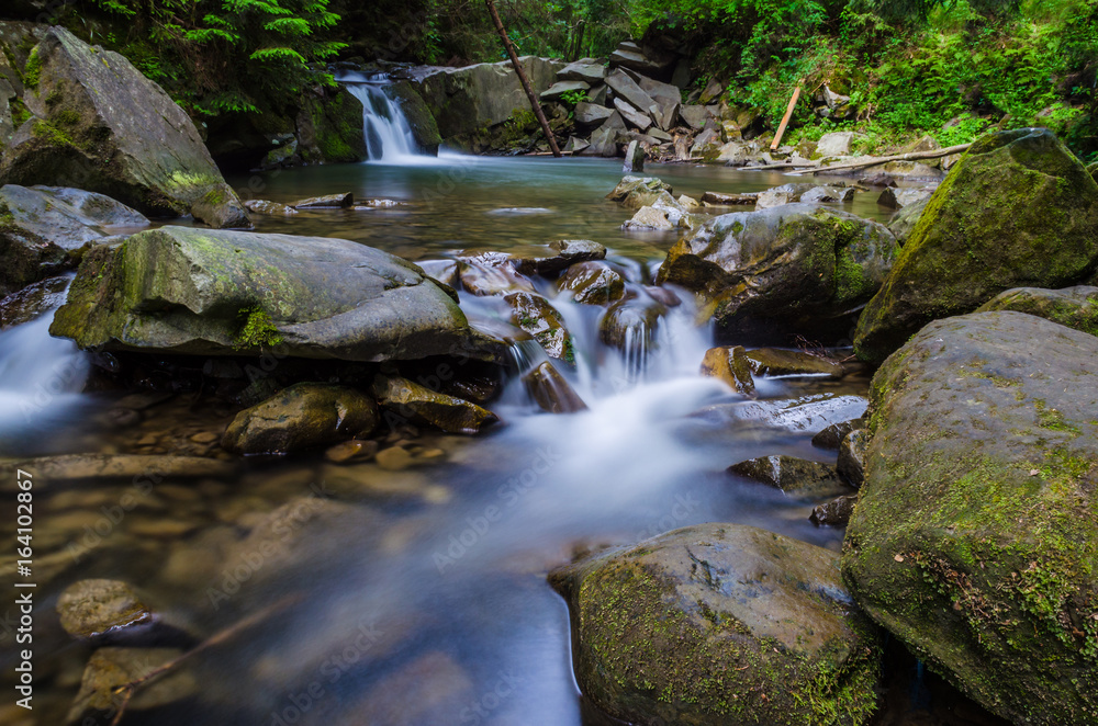 background landscape with waterfall in Yaremche vilage in Ukraine background landscape with waterfall in Yaremche vilage in Ukraine