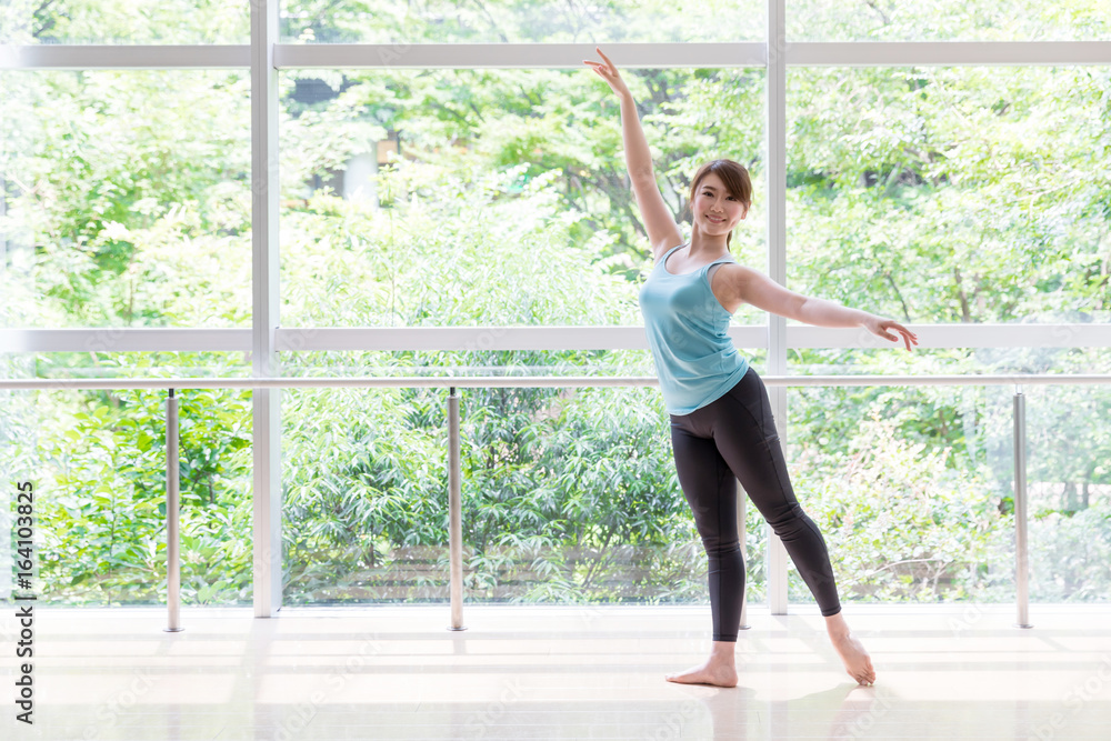 attractive asian woman doing ballet