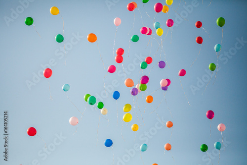colorful balloons fly in the sky