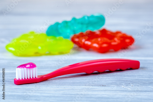 children s toothbrush oral care on wooden background