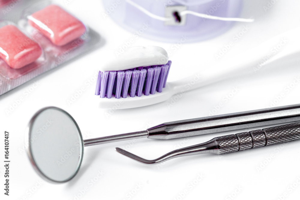 dental care toothbrush with dentist tools on white background dental care toothbrush with dentist tools on white background