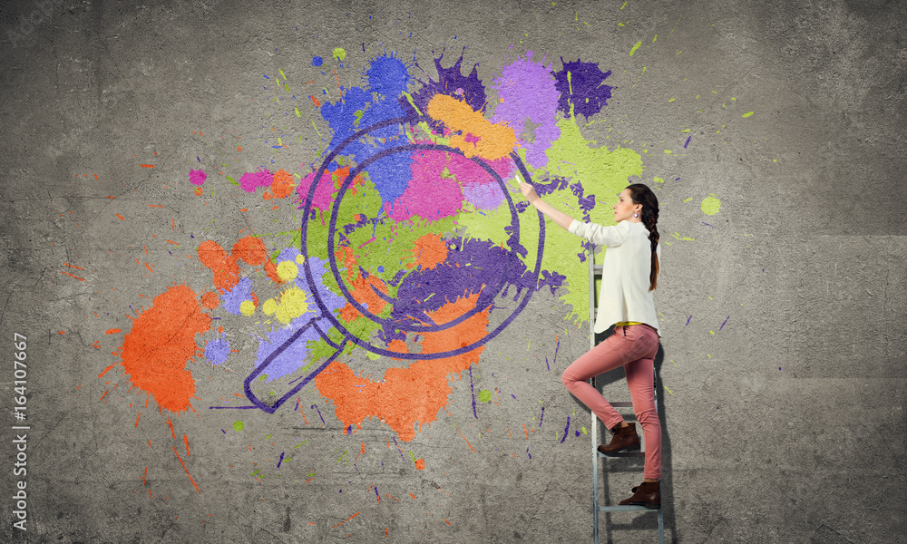 Obraz premium Girl paint wall in colors