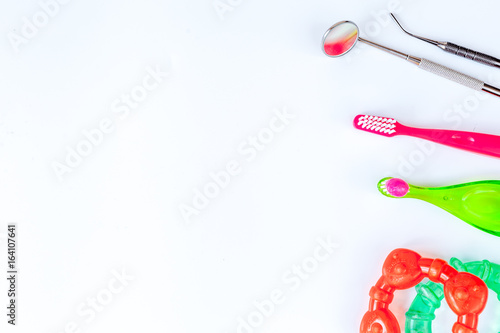 prevention and care children's teeth white background top view