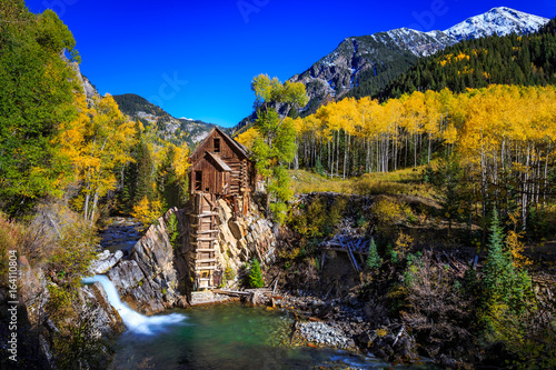 Old Crystal Mill bathed in Fall Colors in Colorado photo