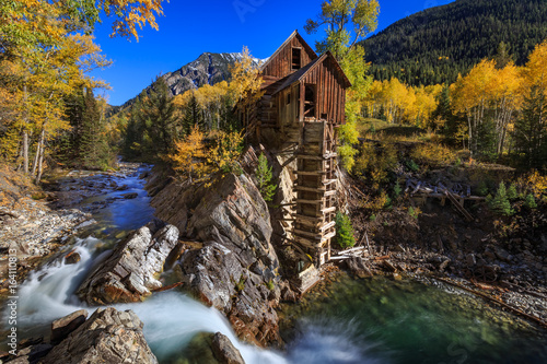 Old Crystal Mill bathed in Fall Colors in Colorado photo