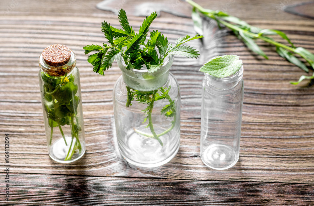 Homeopathy. Store up medicinal herbs. Herbs in glass on wooden table background Homeopathy. Store up medicinal herbs. Herbs in glass on wooden table background
