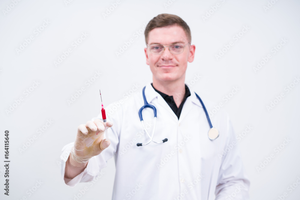 Caucasian man doctor prepare to make injection on white background Caucasian man doctor prepare to make injection on white background