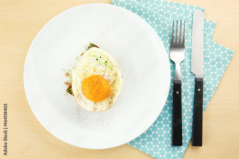 Delicious breakfast with sunny side up egg on table Delicious breakfast with sunny side up egg on table
