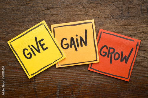 give, gain and grow concept in sticky notes