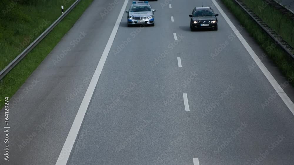 Time-lapse of cars as they drive on a county road. Filmed from an angled overhead perspective. Time-lapse of cars as they drive on a county road. Filmed from an angled overhead perspective.
