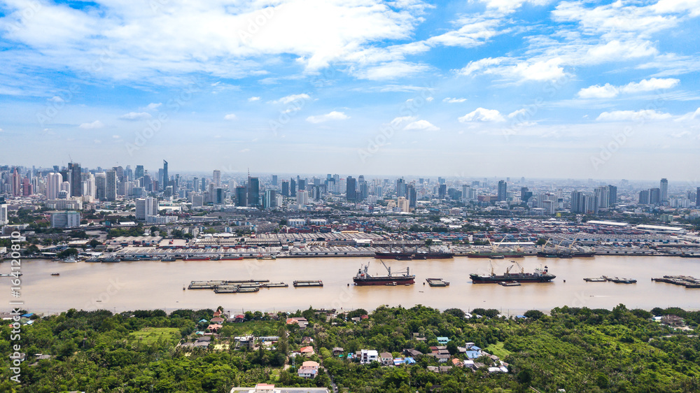 Aerial View of Bangkok skyline and view of Chao Phraya River View from green zone in Bang Krachao, Phra Pradaeng, Samut Prakan Province.
