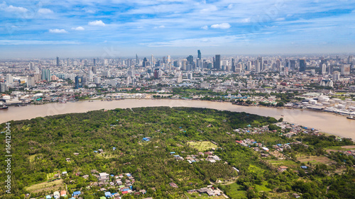Aerial View of Bangkok skyline and view of Chao Phraya River View from green zone in Bang Krachao, Phra Pradaeng, Samut Prakan Province.