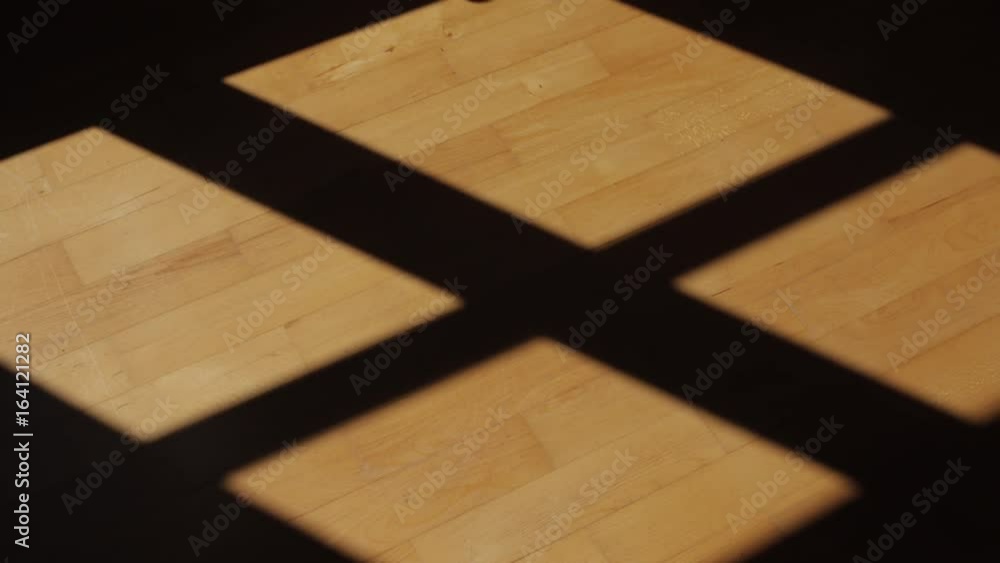 Time-lapse of shadows moving on a hardwood floor. Time-lapse of shadows moving on a hardwood floor.
