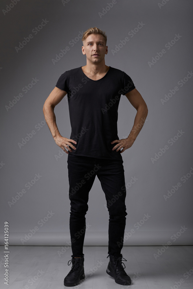 Handsome blond young man posing at studio Handsome blond young man posing at studio