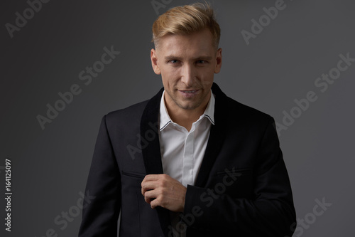 Handsome blond young man posing at studio