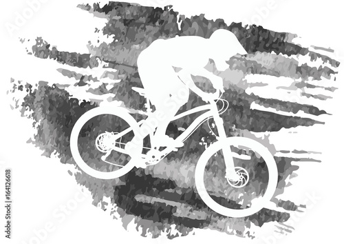 Silhouette of a cyclist riding a mountain bike
