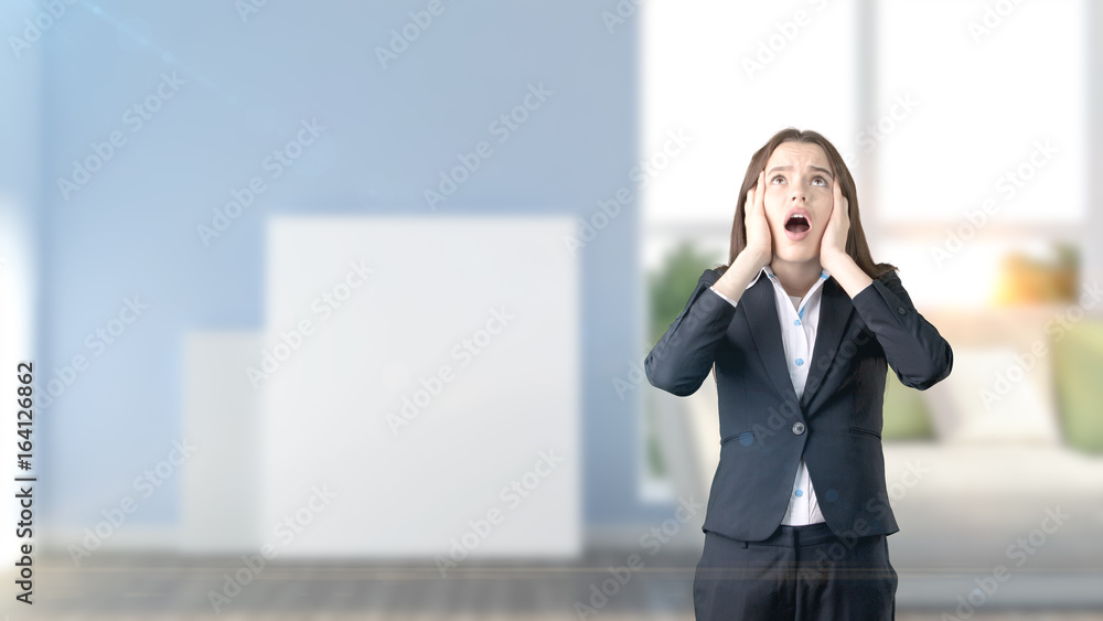 Young beautiful business woman and creative designer standing over blured interior background Young beautiful business woman and creative designer standing over blured interior background